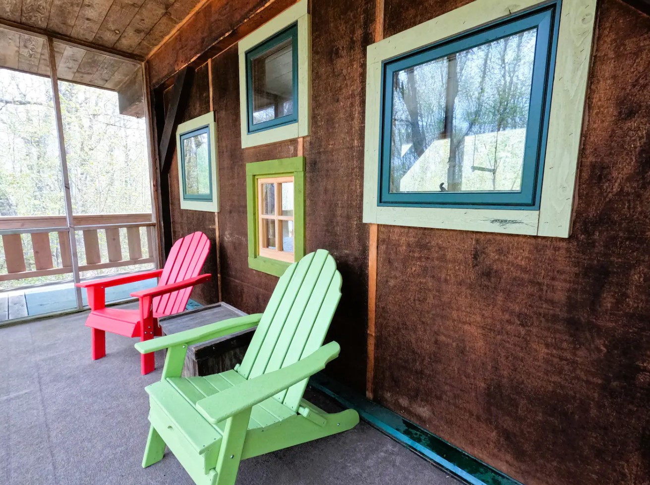 deck with wooden chairs and windows