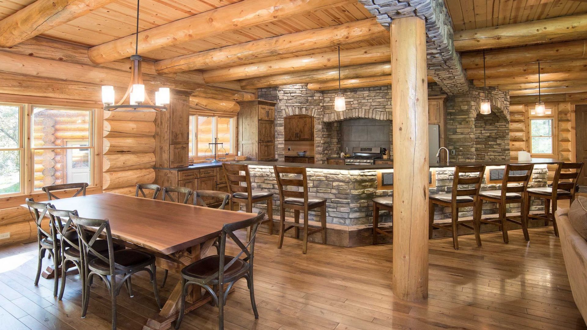 dining room and kitchen area with a big L-shaped bar/ kitchen island, lots of chairs to sit