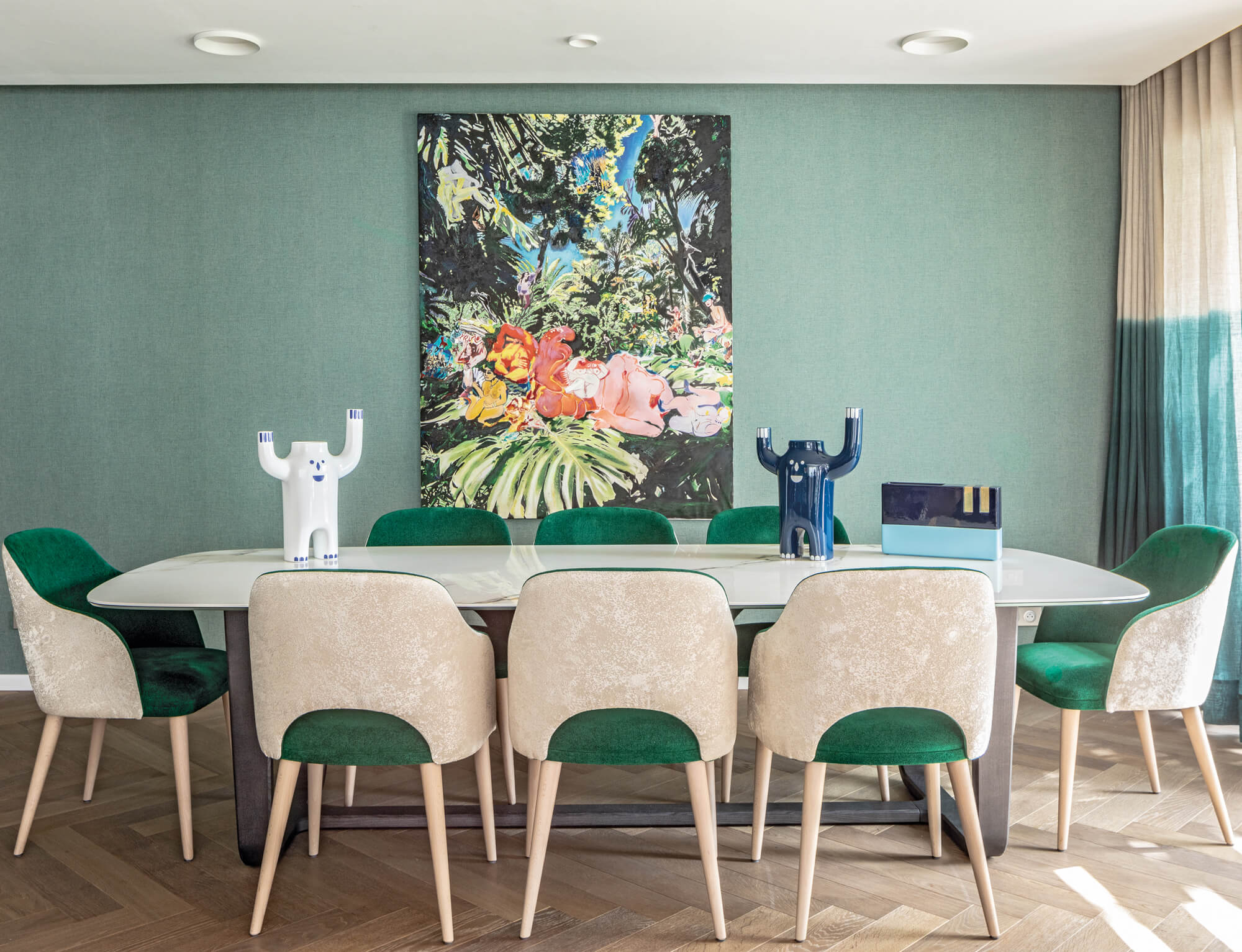 dining room with a green wall, floral painting, white dining table and green and white chairs