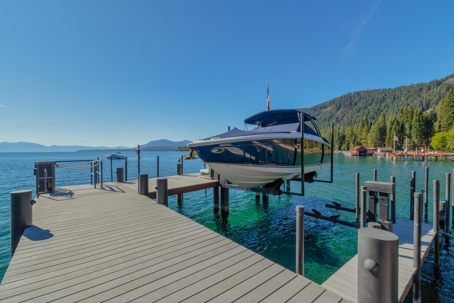 dock with a boat, sunny skies