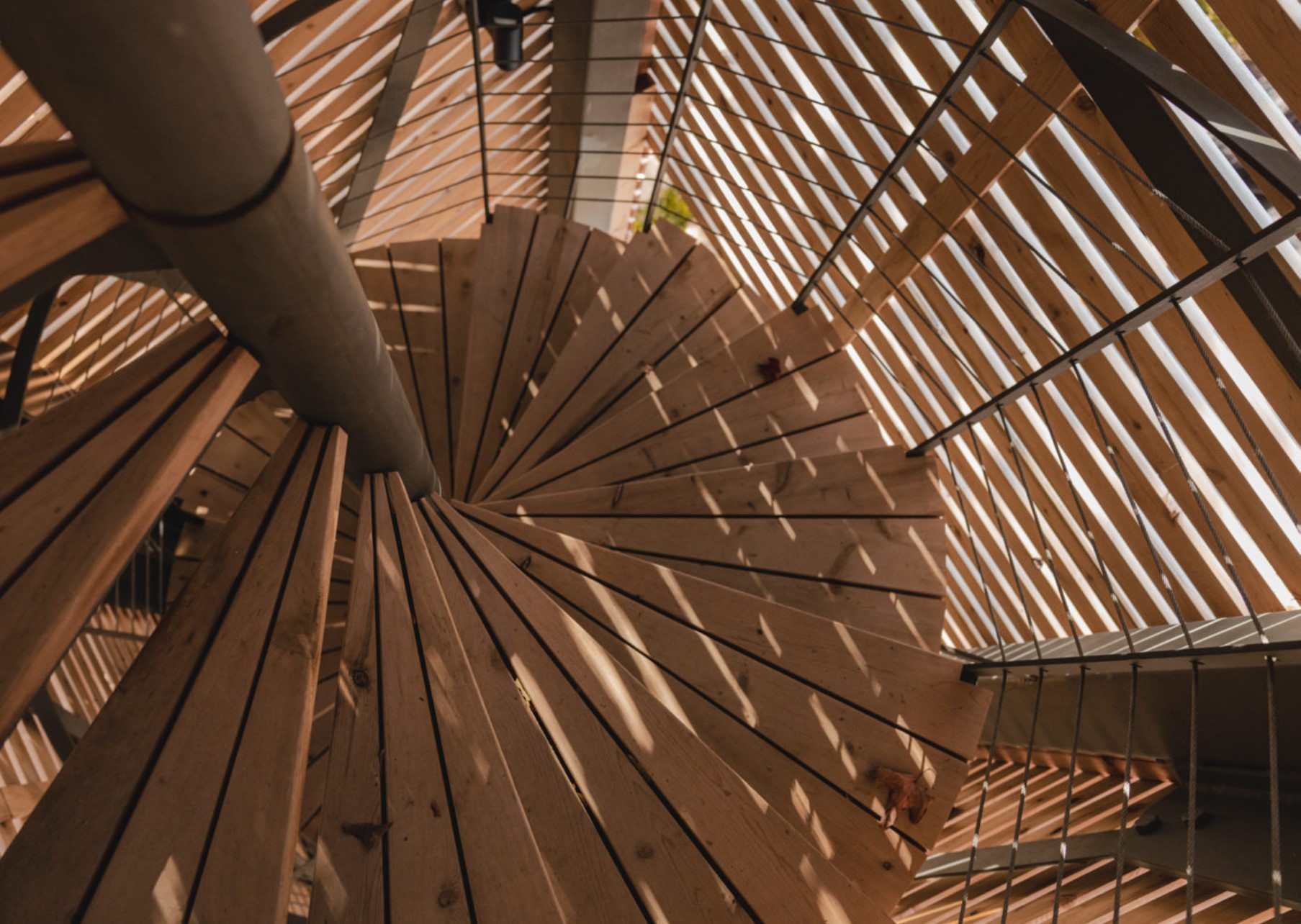 enclosed wooden stair case leading to a cabin