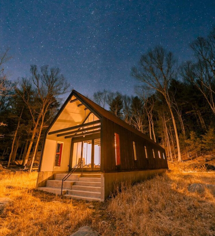 exterior of a cabin with a starry sky