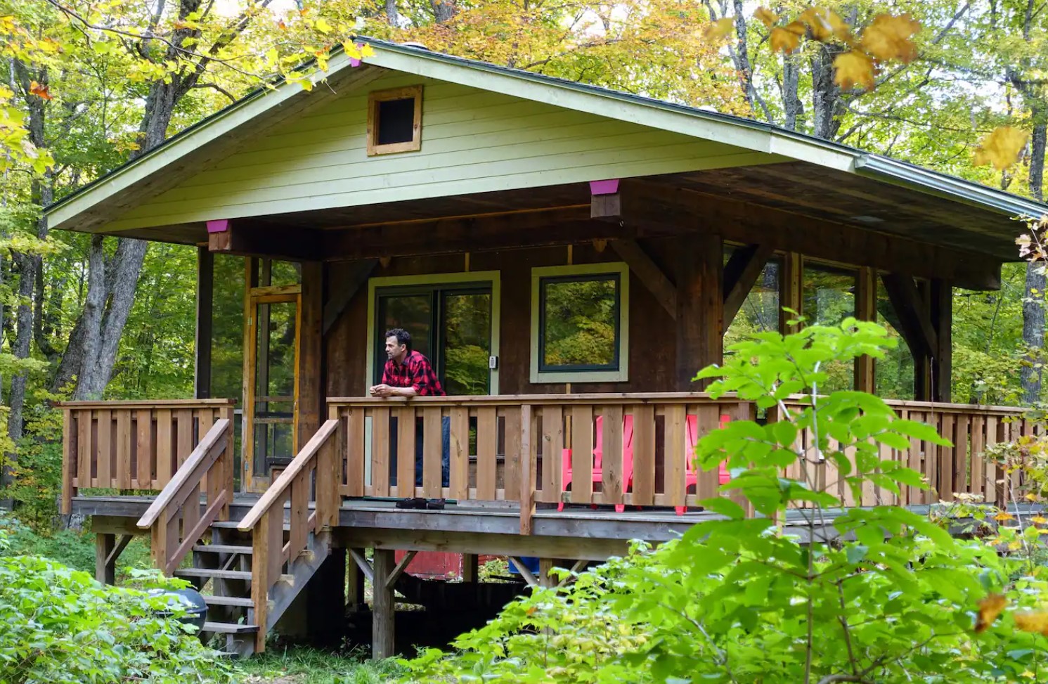 exterior of wooden cabin with wraparound porch