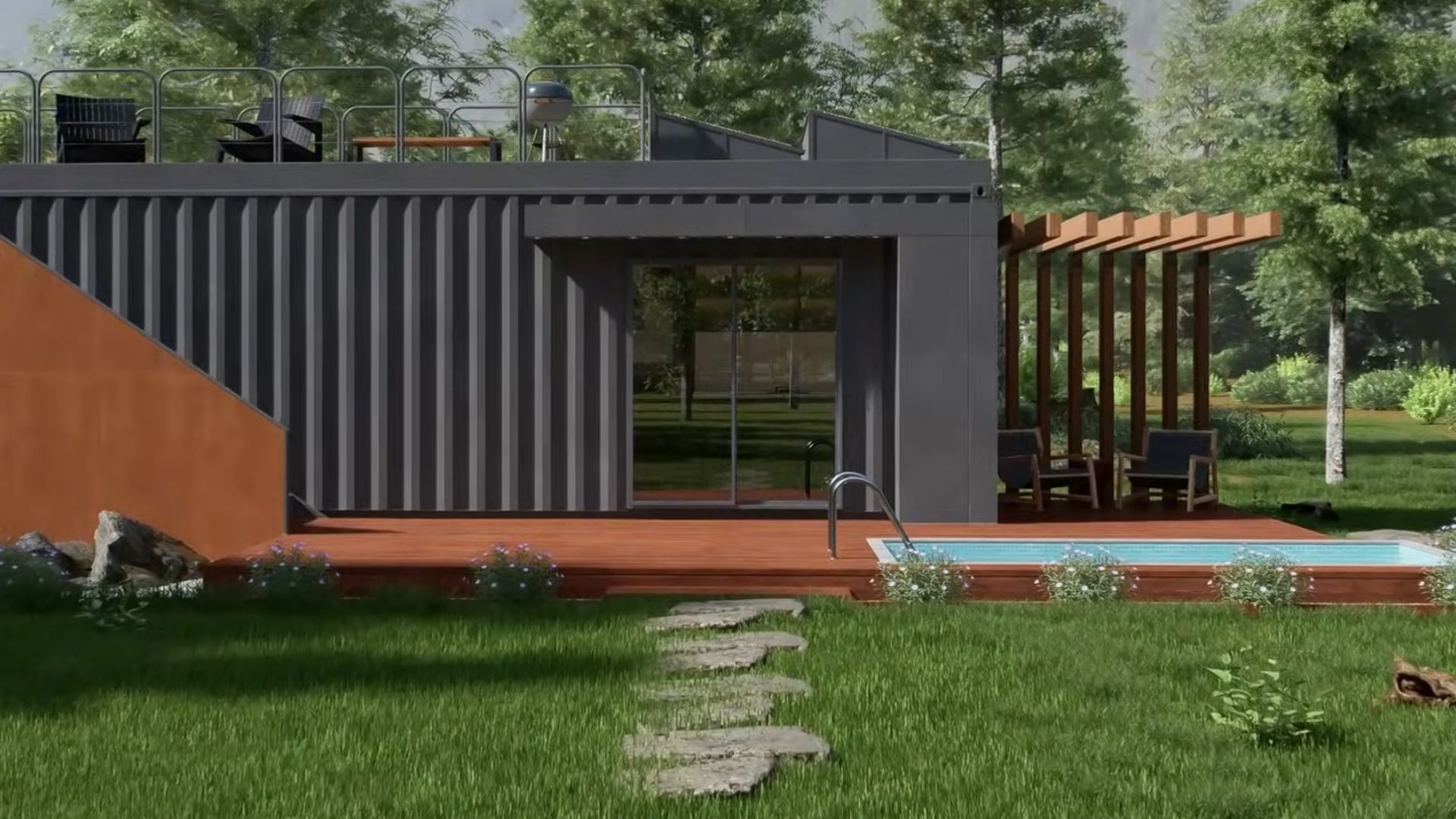 outside the container house with black walls and wooden patio and stairs, surrounded by greenery