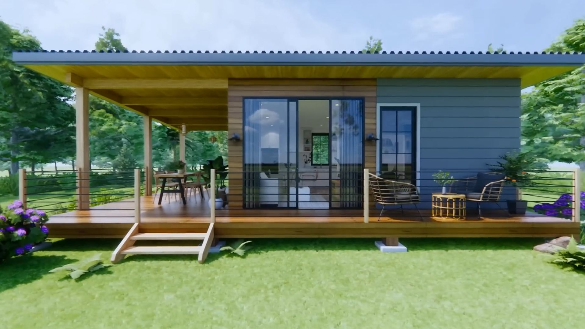 exterior of a tiny house in grey and wooden planks with a flat roof, an L-shaped porch, surrounded by greenery