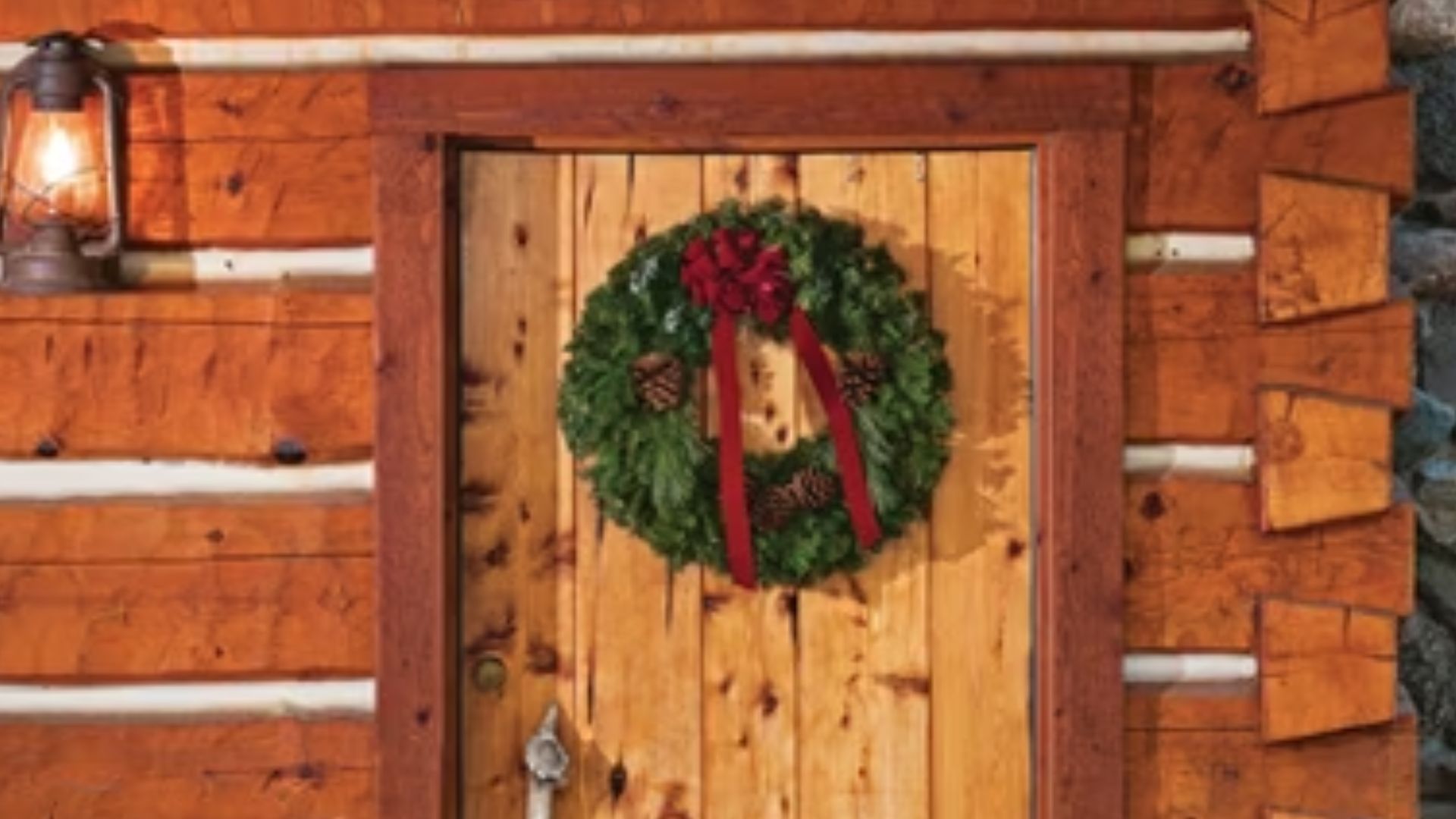 wooden exterior wit front door and a wreath on tthem