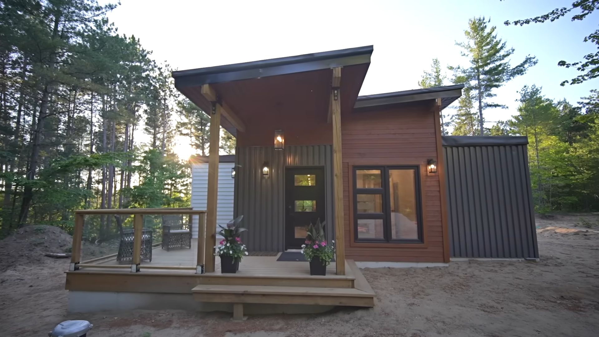 front of the container home from a lower perspective with a small deck