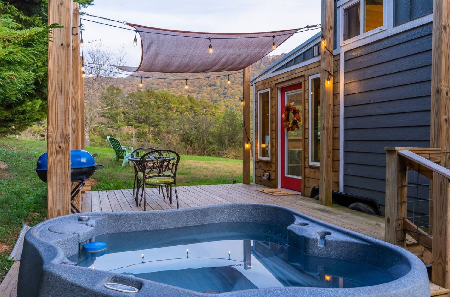 Hot tub on the patio of tiny house