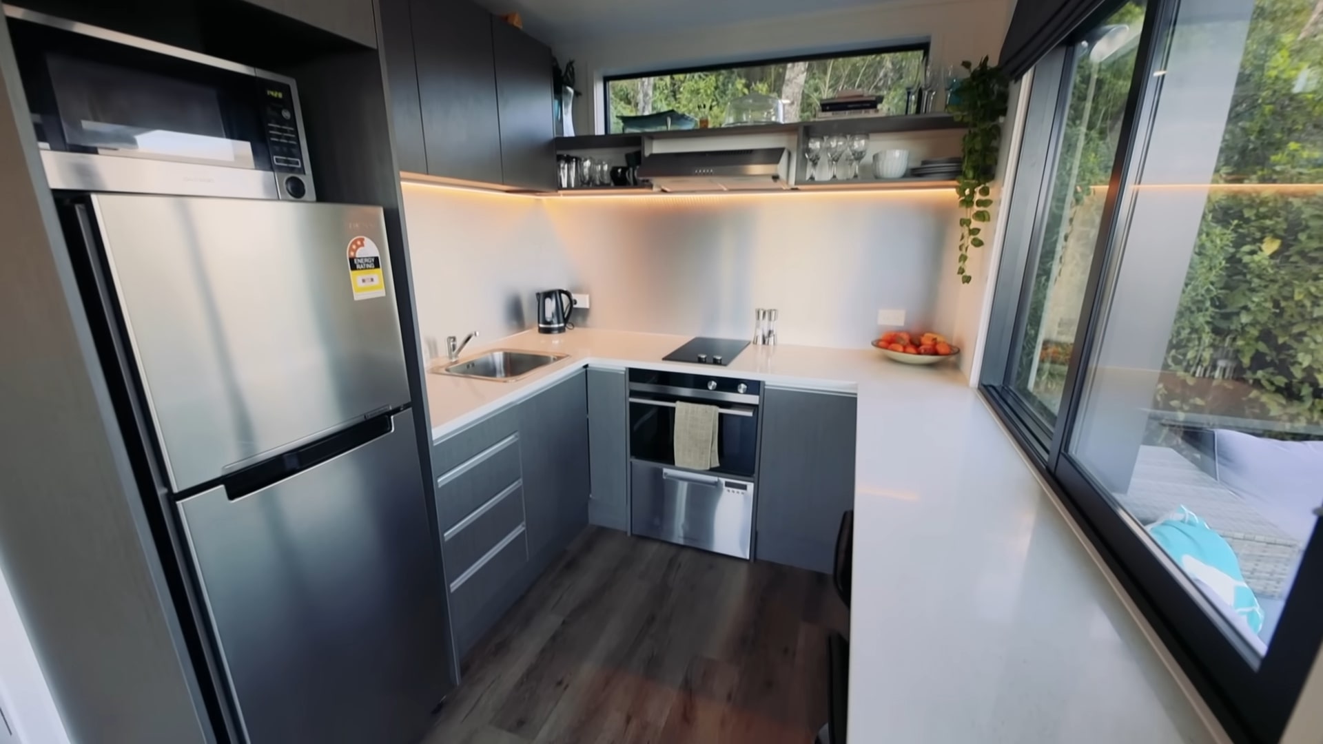 Kitchen with gray appliances and large marble counter