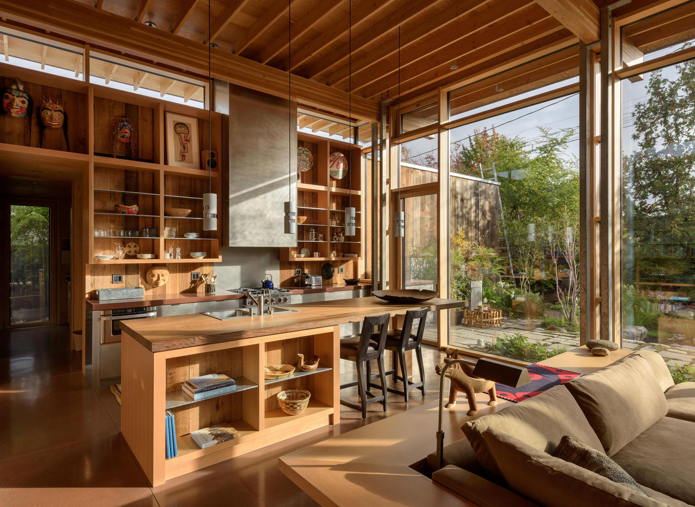 kitchen with open cabinets and floor to ceiling windows