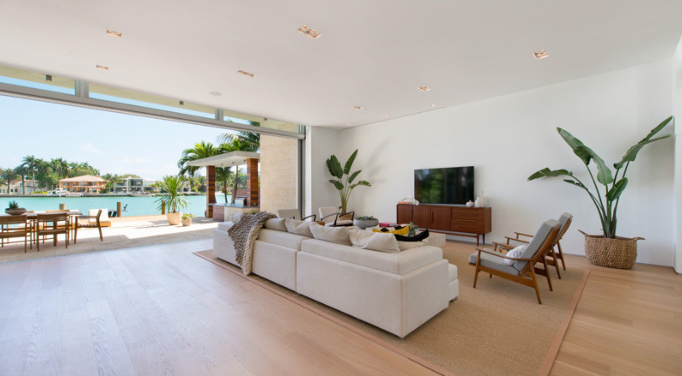 Living room with white couch and tv