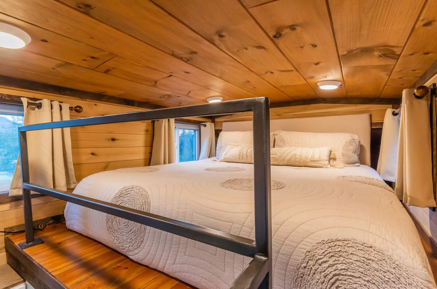 Loft white bed in tiny house