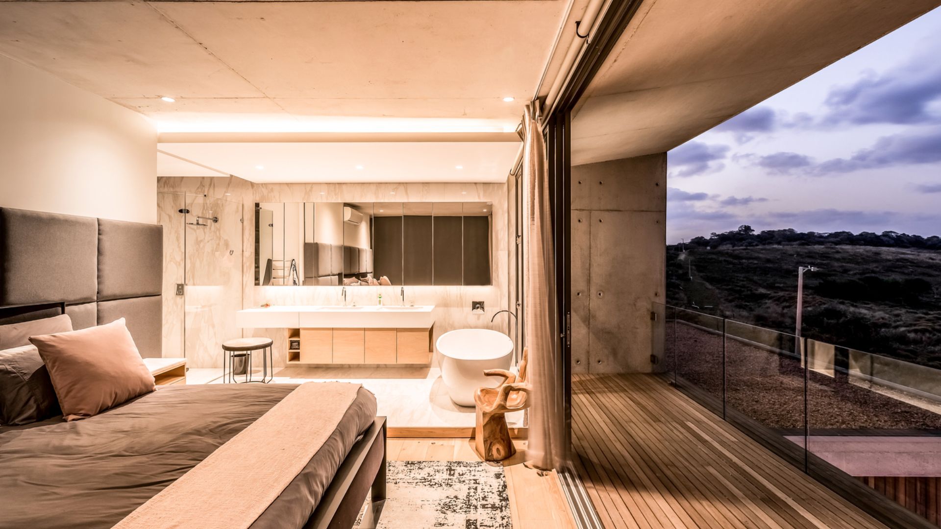 luxurious ensuite bathroom with lots of vanity space and a beautiful stylish tub