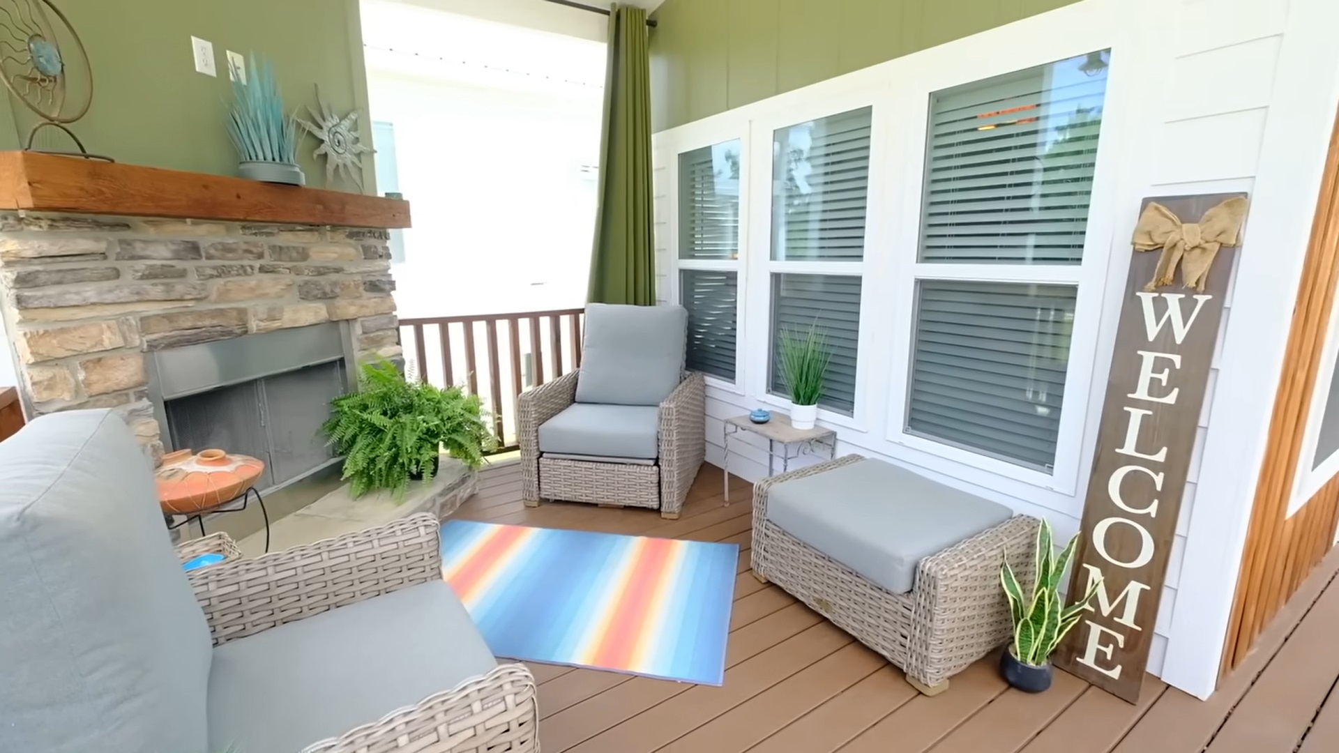 outdoors area of a tiny house with gray sofas and tiny tables