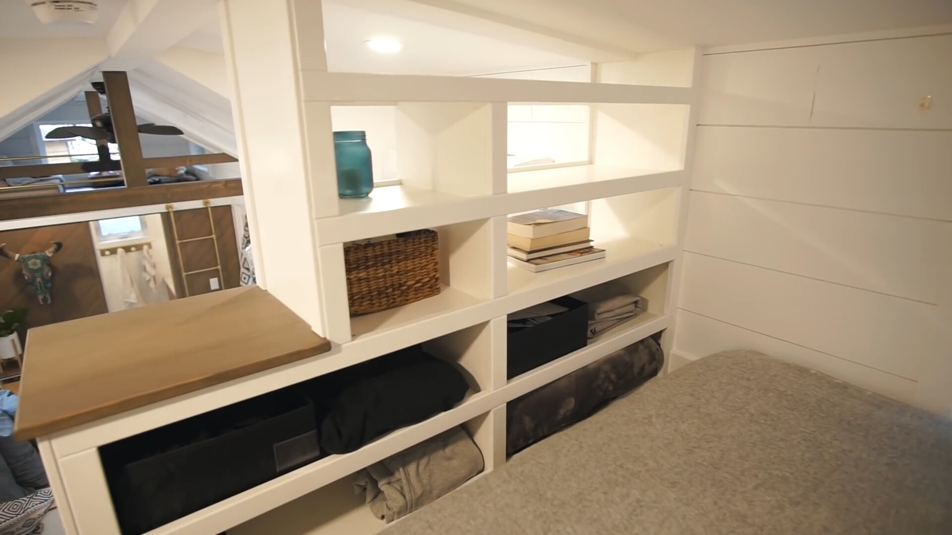 white shelves in the loft area