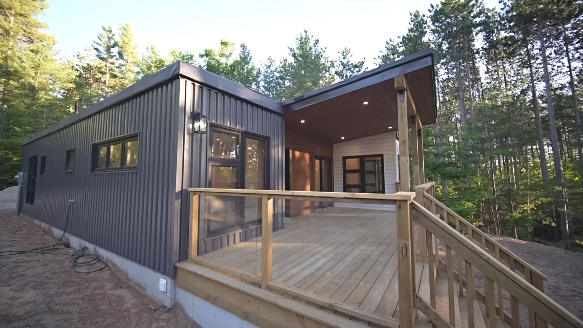 side photo of the rear deck with wooden fence