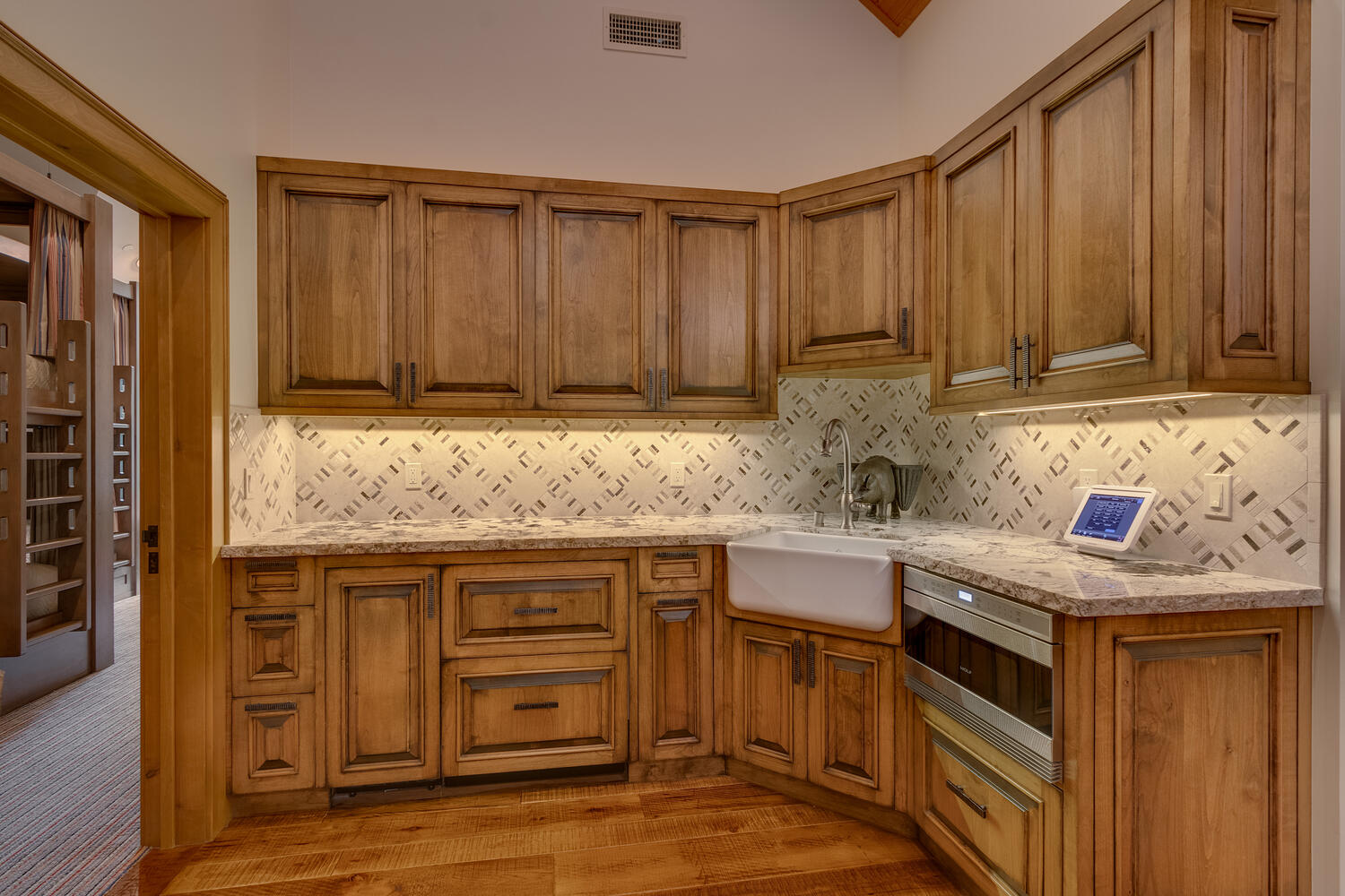 kitchen with marble countertop and brown cabinet