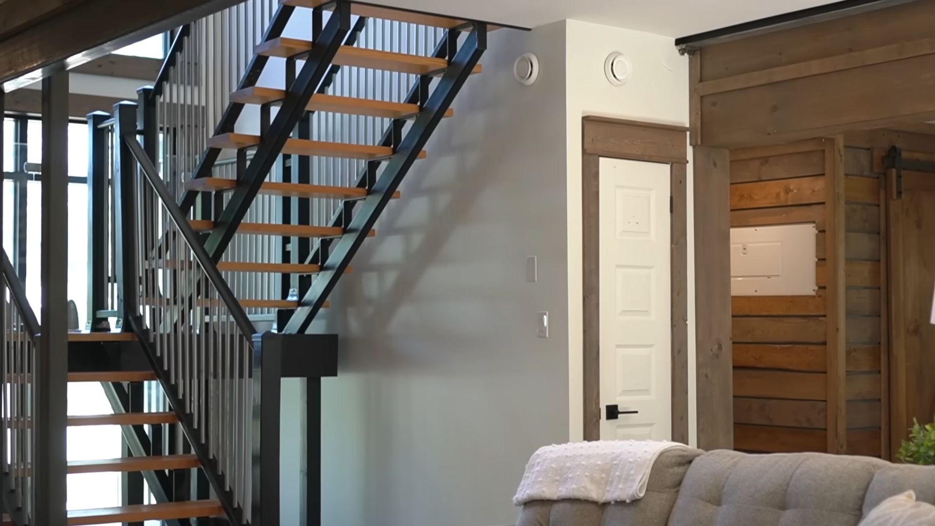 steel construction staircase and wooden details in the house