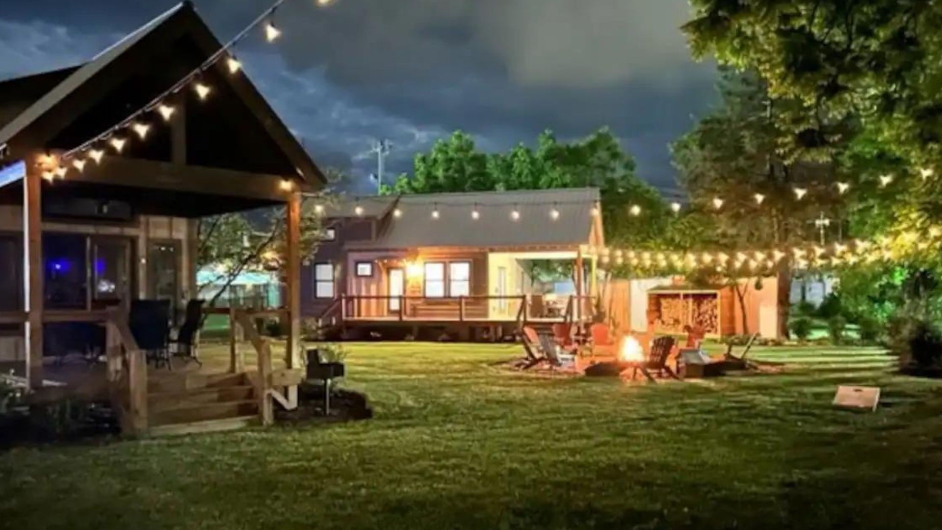 tiny houses at night with lovely string lights glowing 