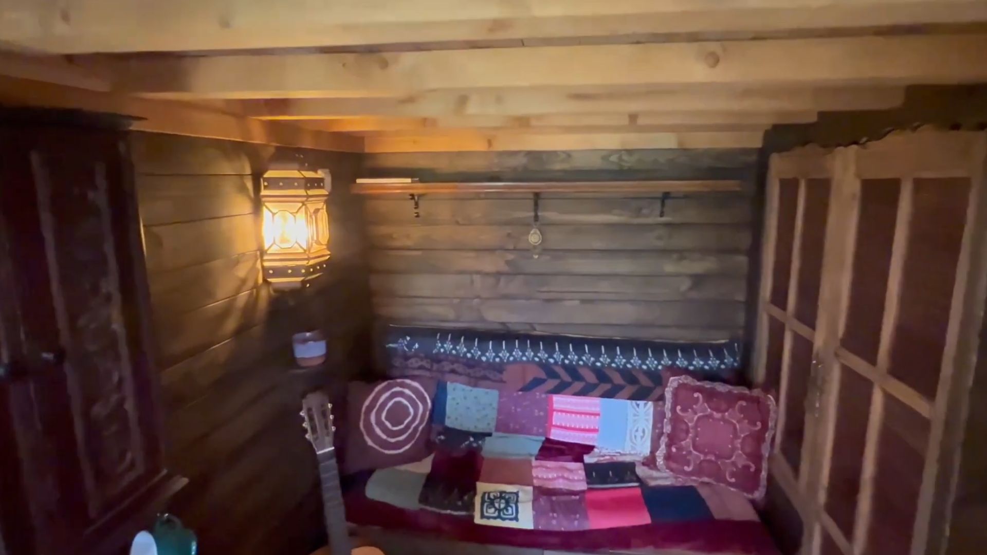 small living room area with a sofa under the loft and a closet next to it under the stairs