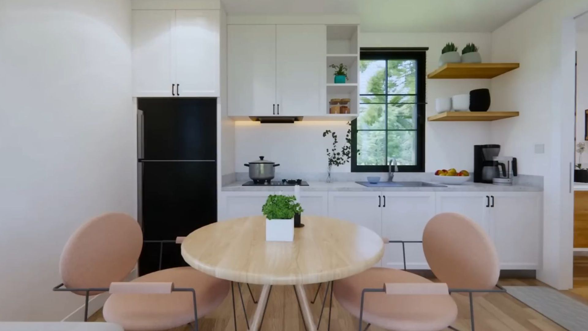 white kitchen with wooden details, a black fridge, and a wooden dining room set with a round table