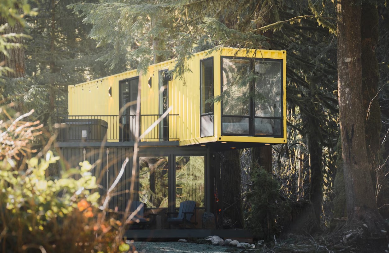 yellow container house in the woods