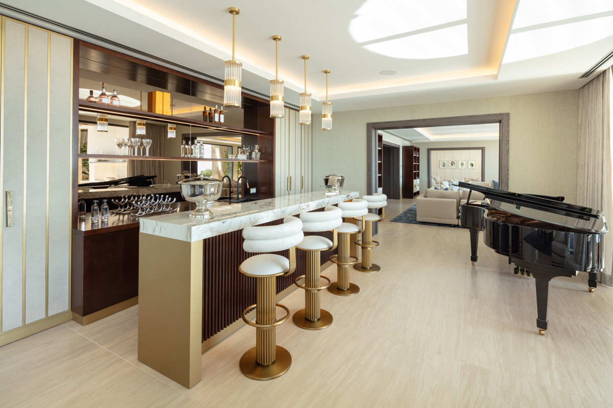 Dining room marble bar with a grand piano