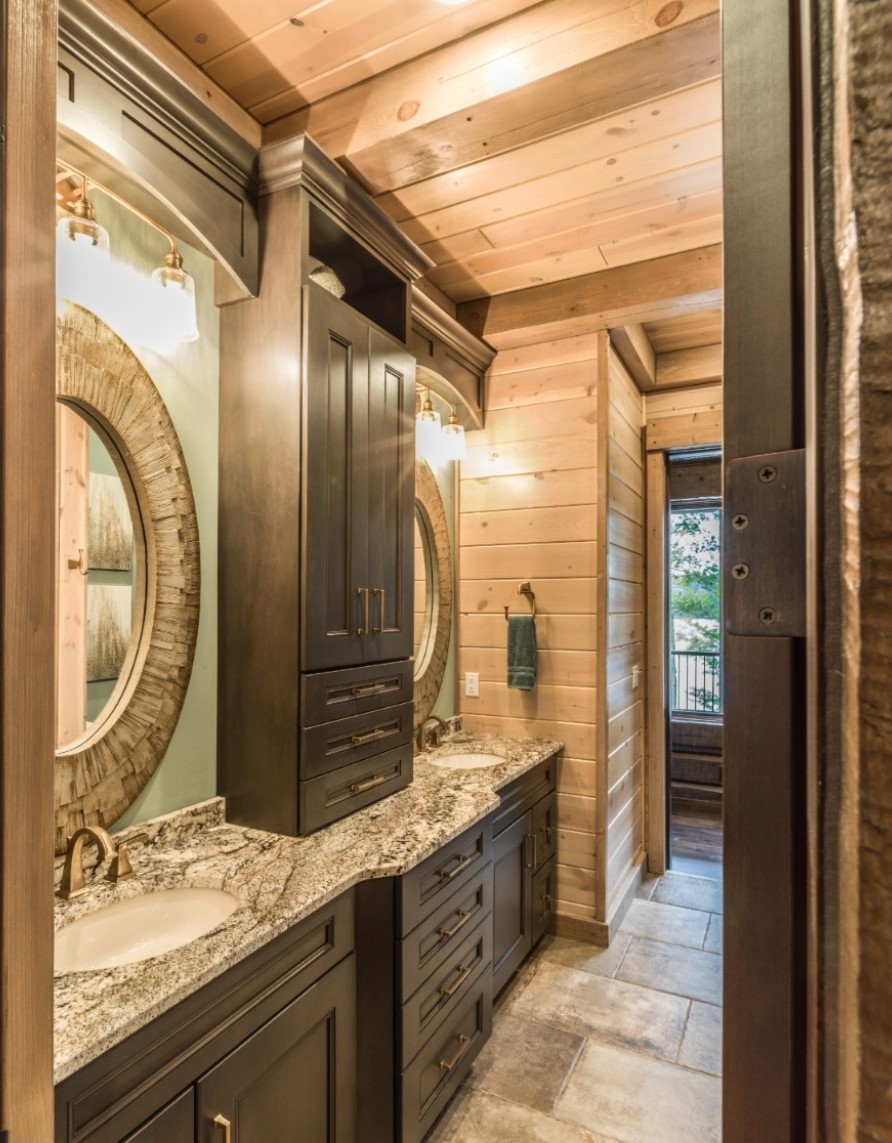 Stunning wooden bathroom with granite vanity and mirrors