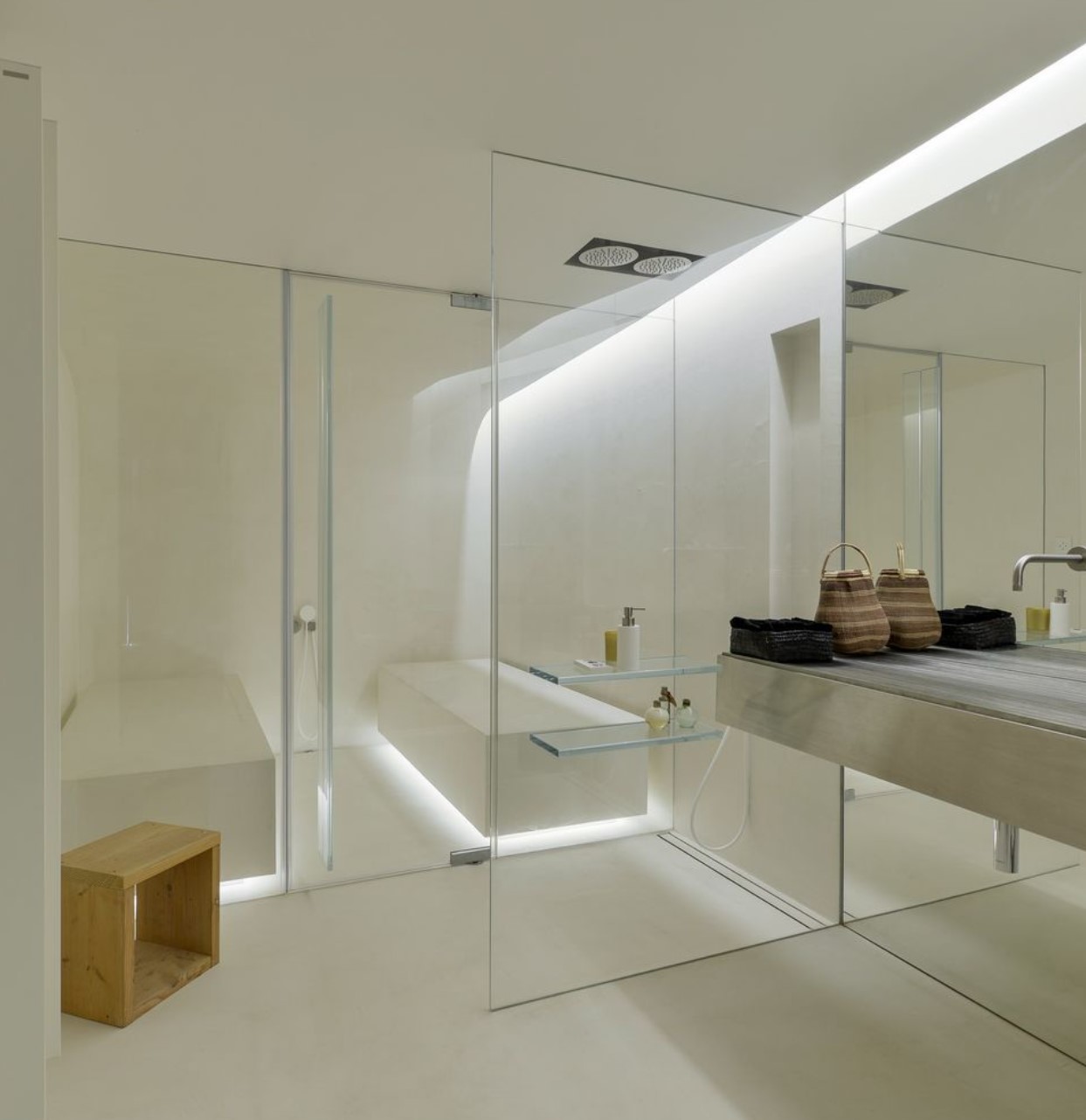 White bathroom with huge walk-in shower and floating vanity