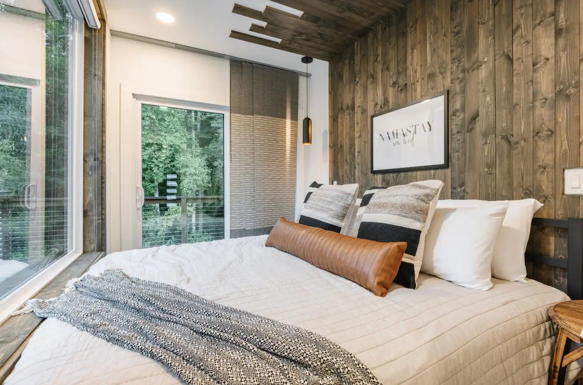 Bedroom with king-sized bed and two large windows