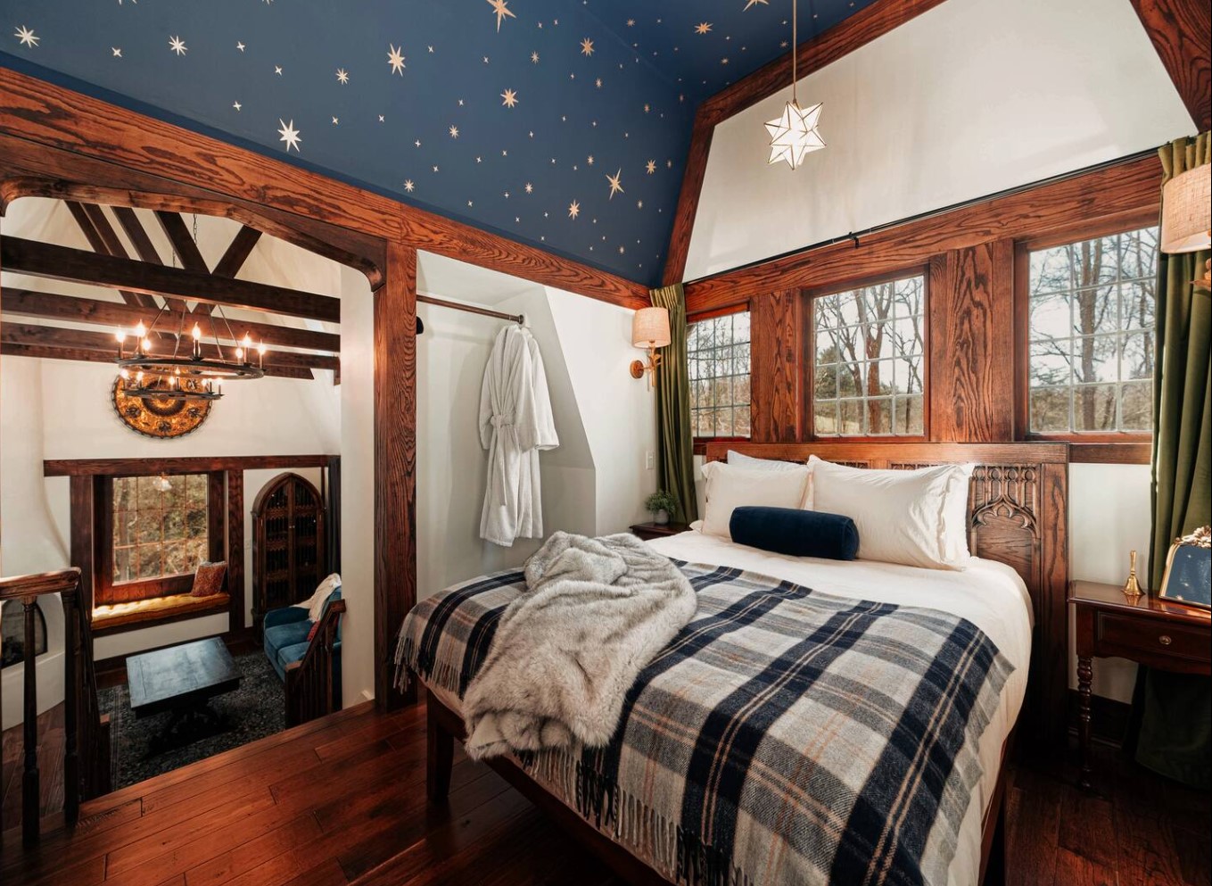 Bedroom with wooden beams and painted ceiling