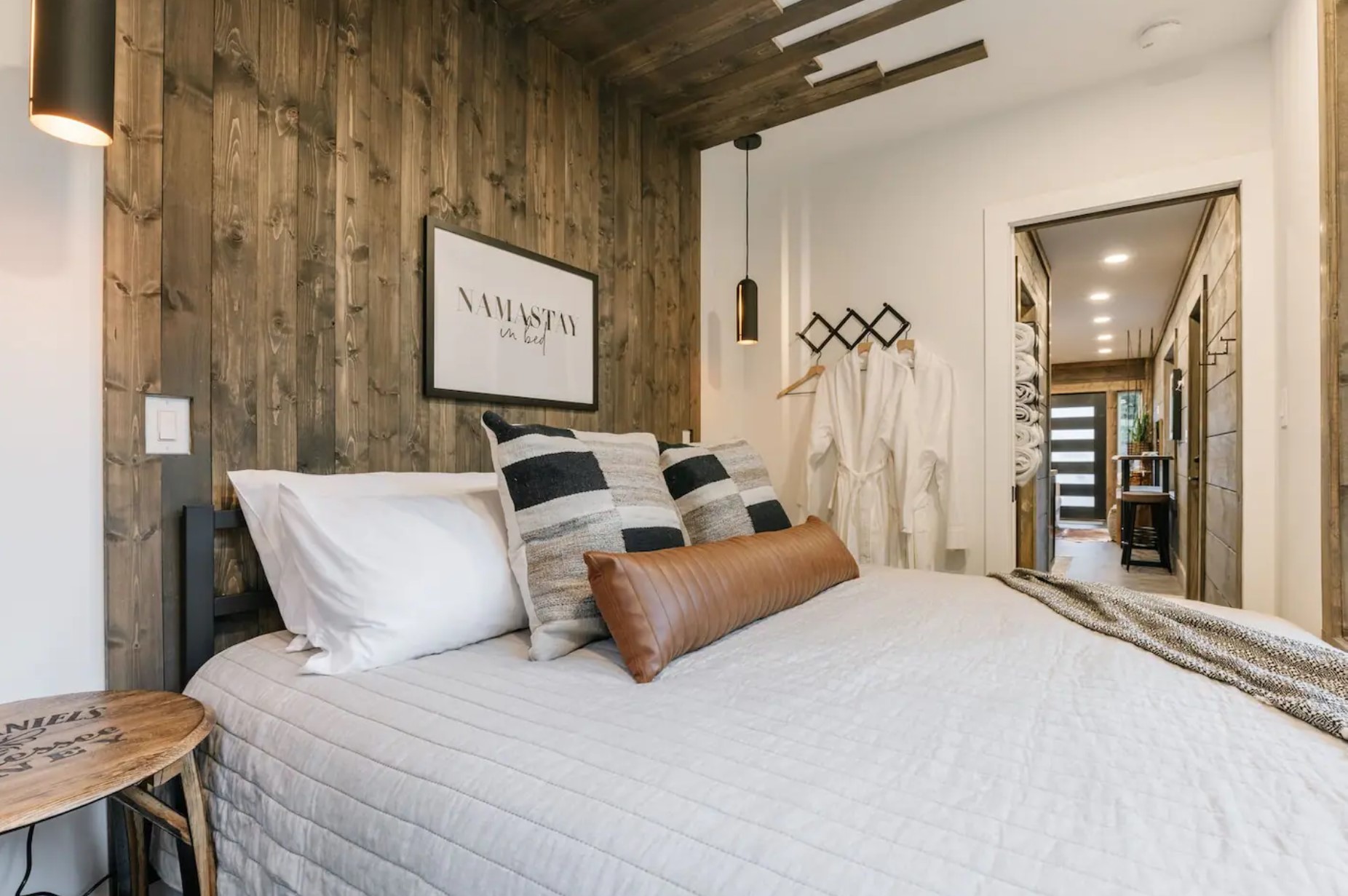 Bedroom with king-sized bet and wooden decorations