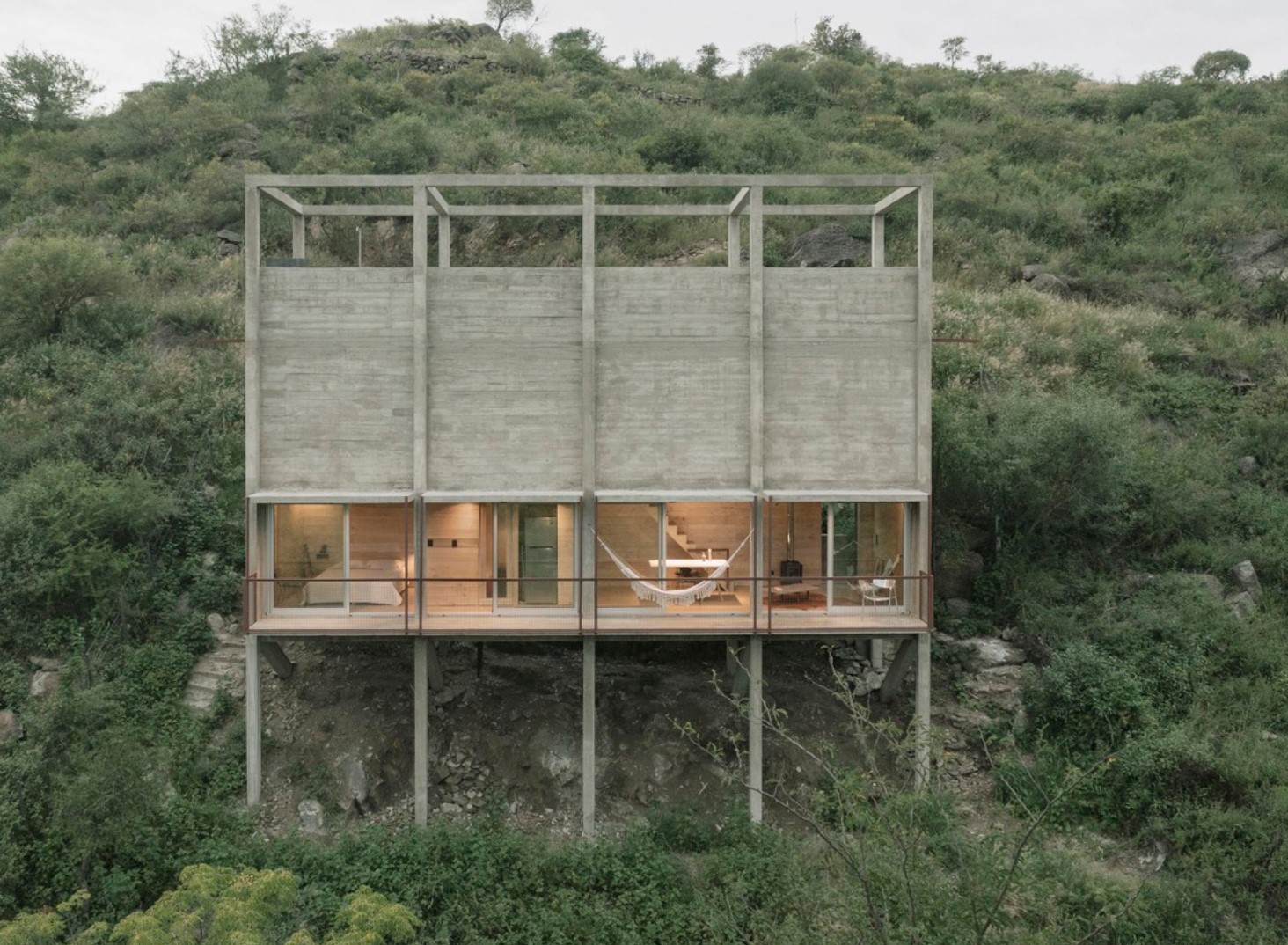 Concrete home on a hill with a huge balcony