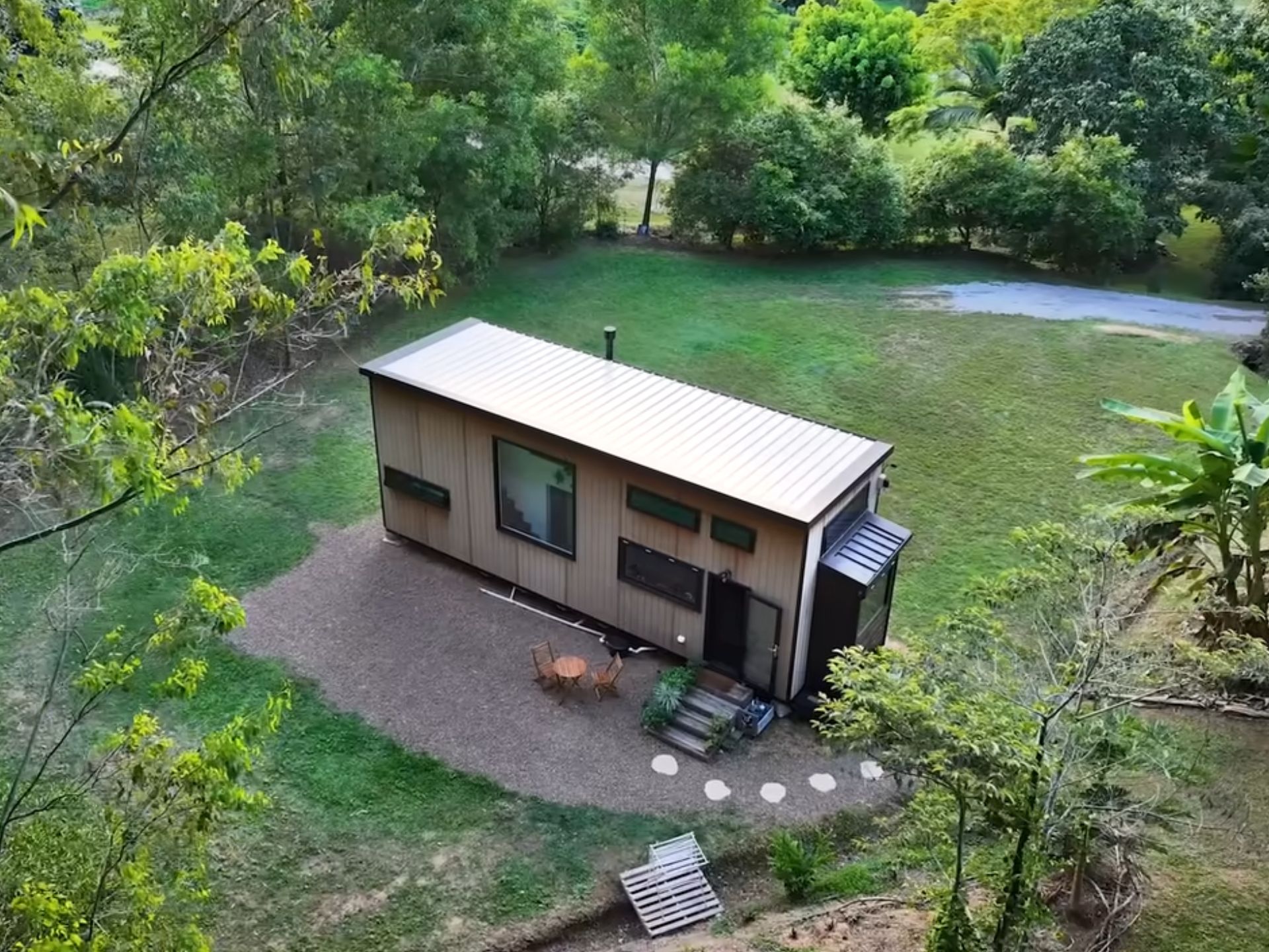 Wooden tiny home in a field