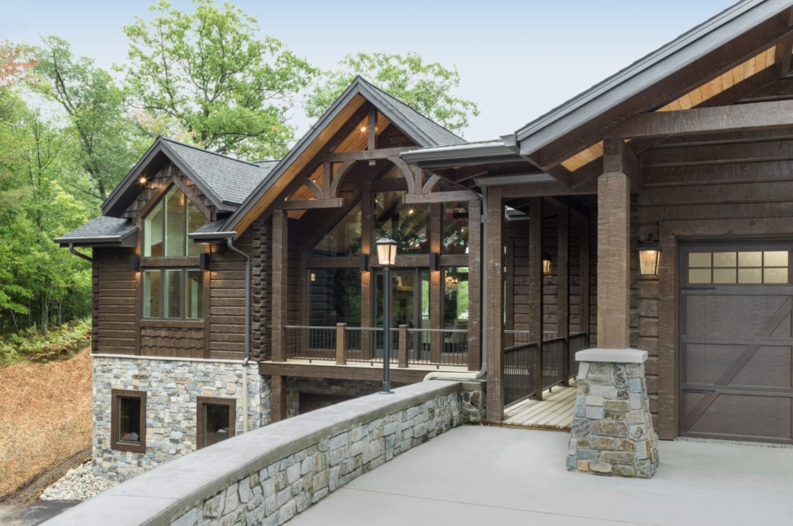 Exterior of wooden mansion with large windows