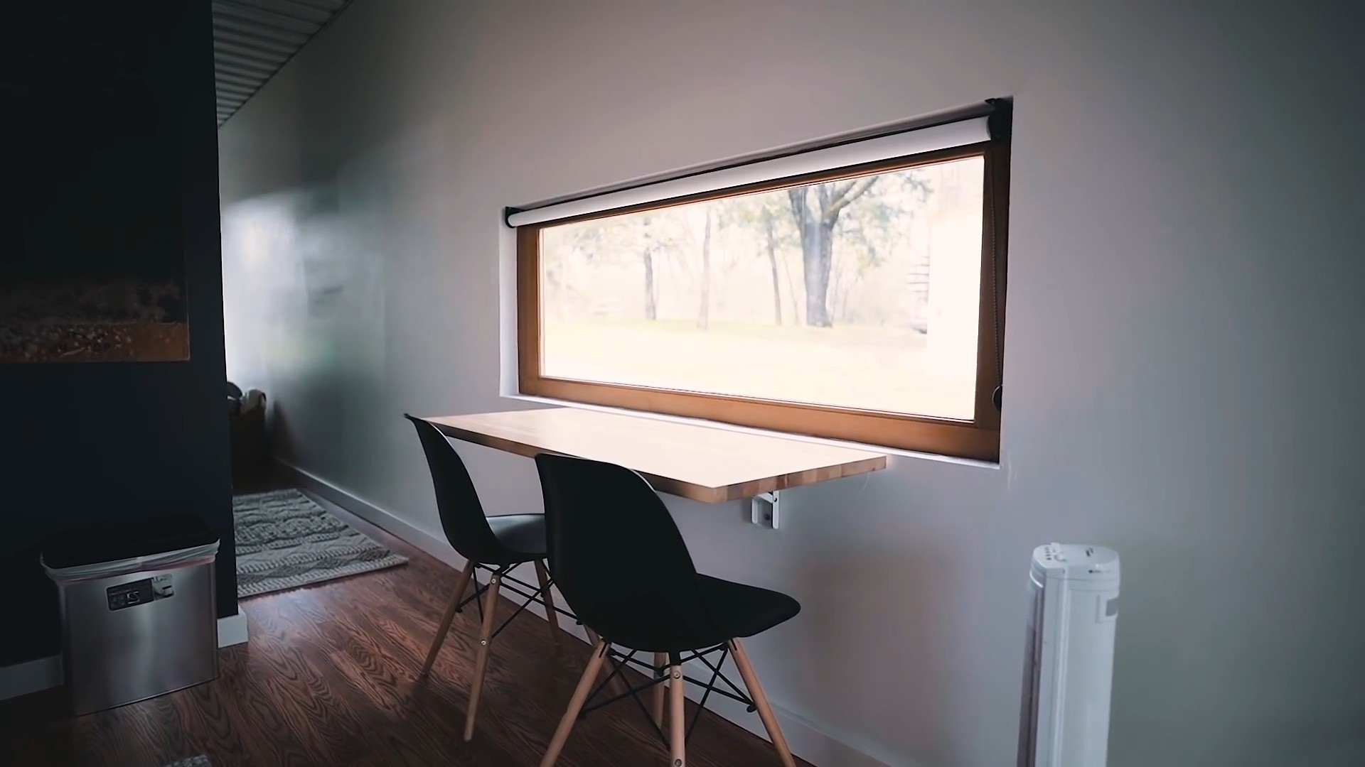 Foldable dining table in front of a window