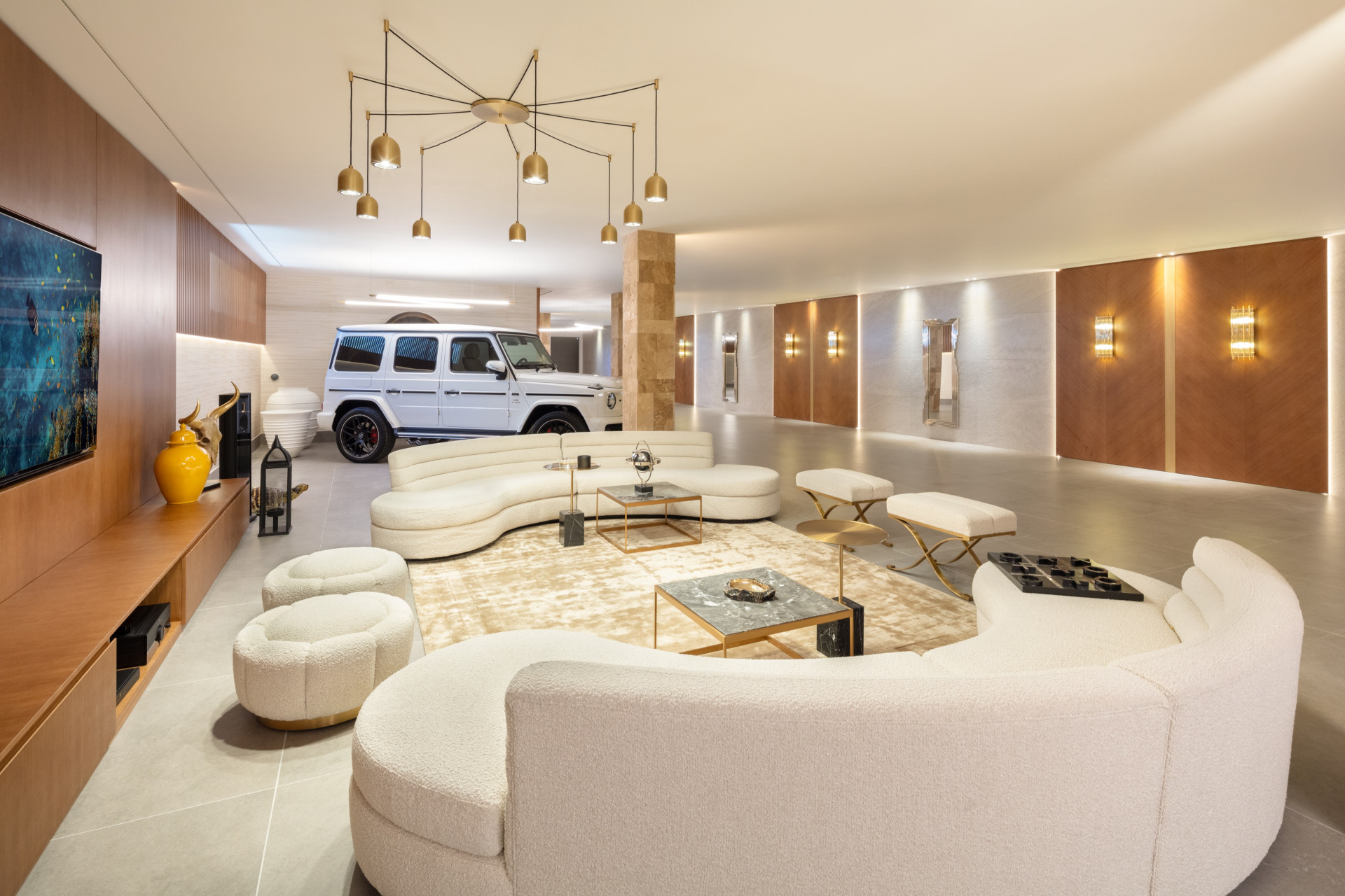 Huge garage with a lounge area and a TV