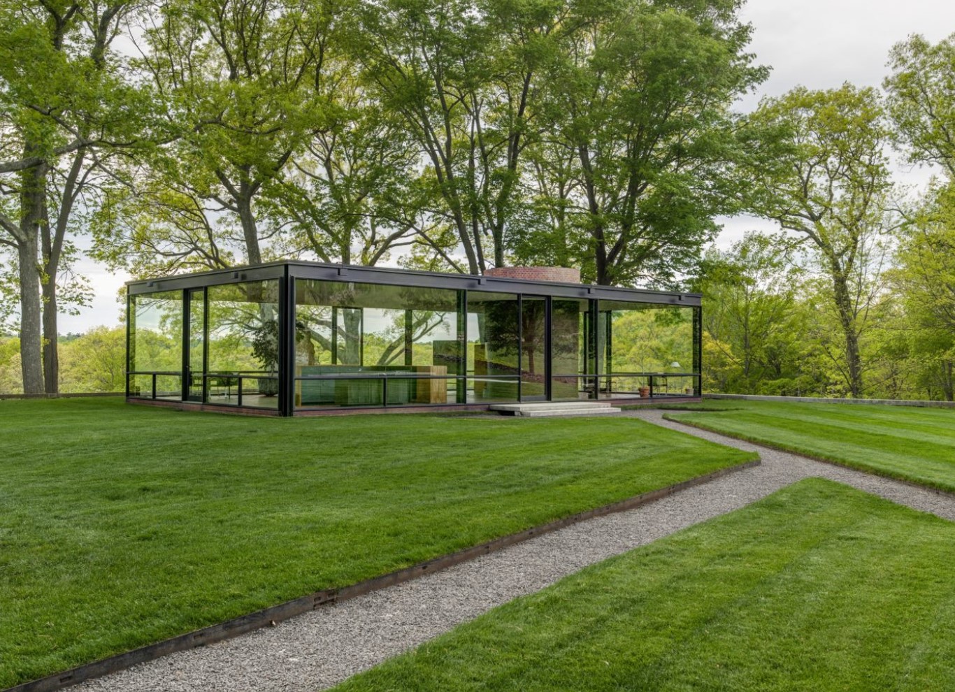 Glass home in the middle of stunning nature