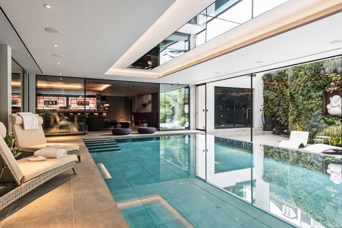 Indoor pool with lounge chairs