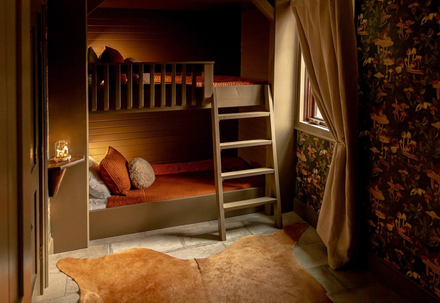 Kids room with bunk beds and wallpaper