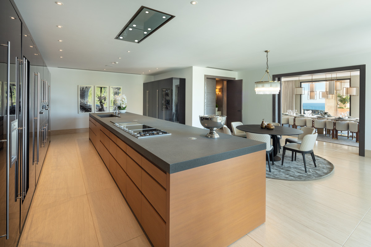 Kitchen with massive island and a small dining table