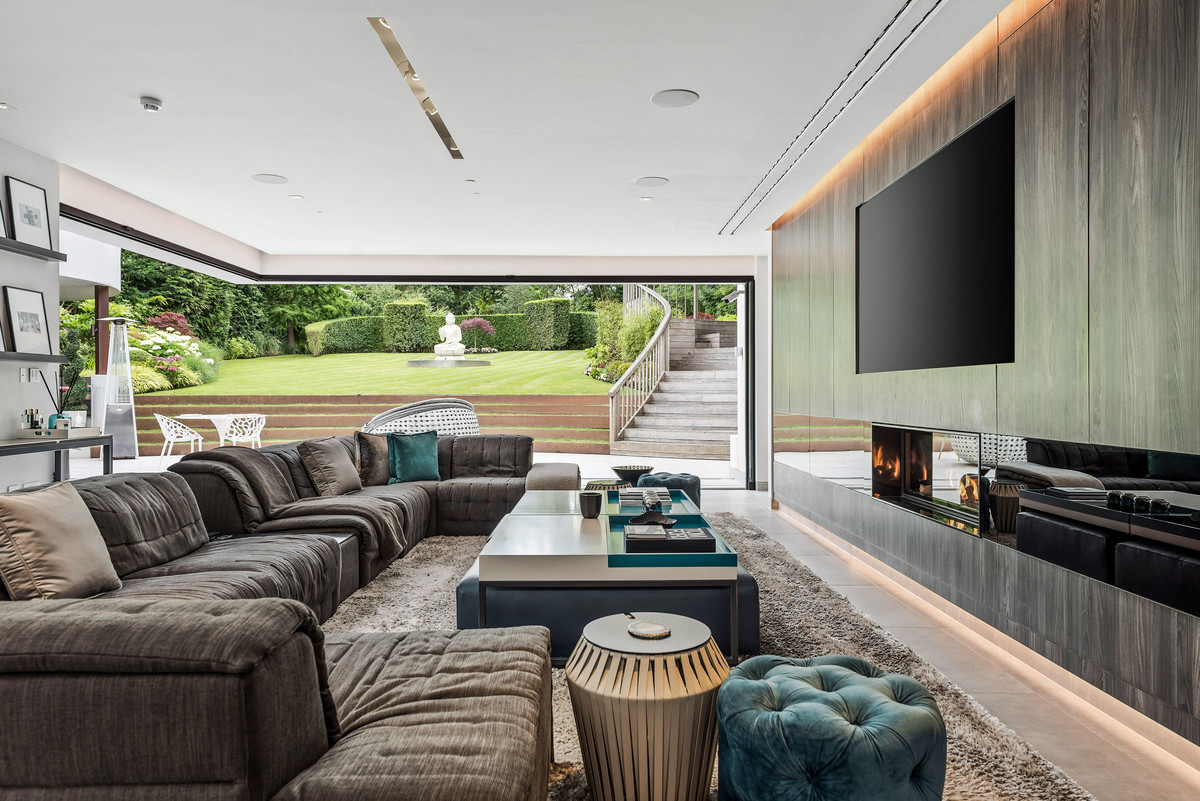 Living room with huge TV and a portal to the backyard