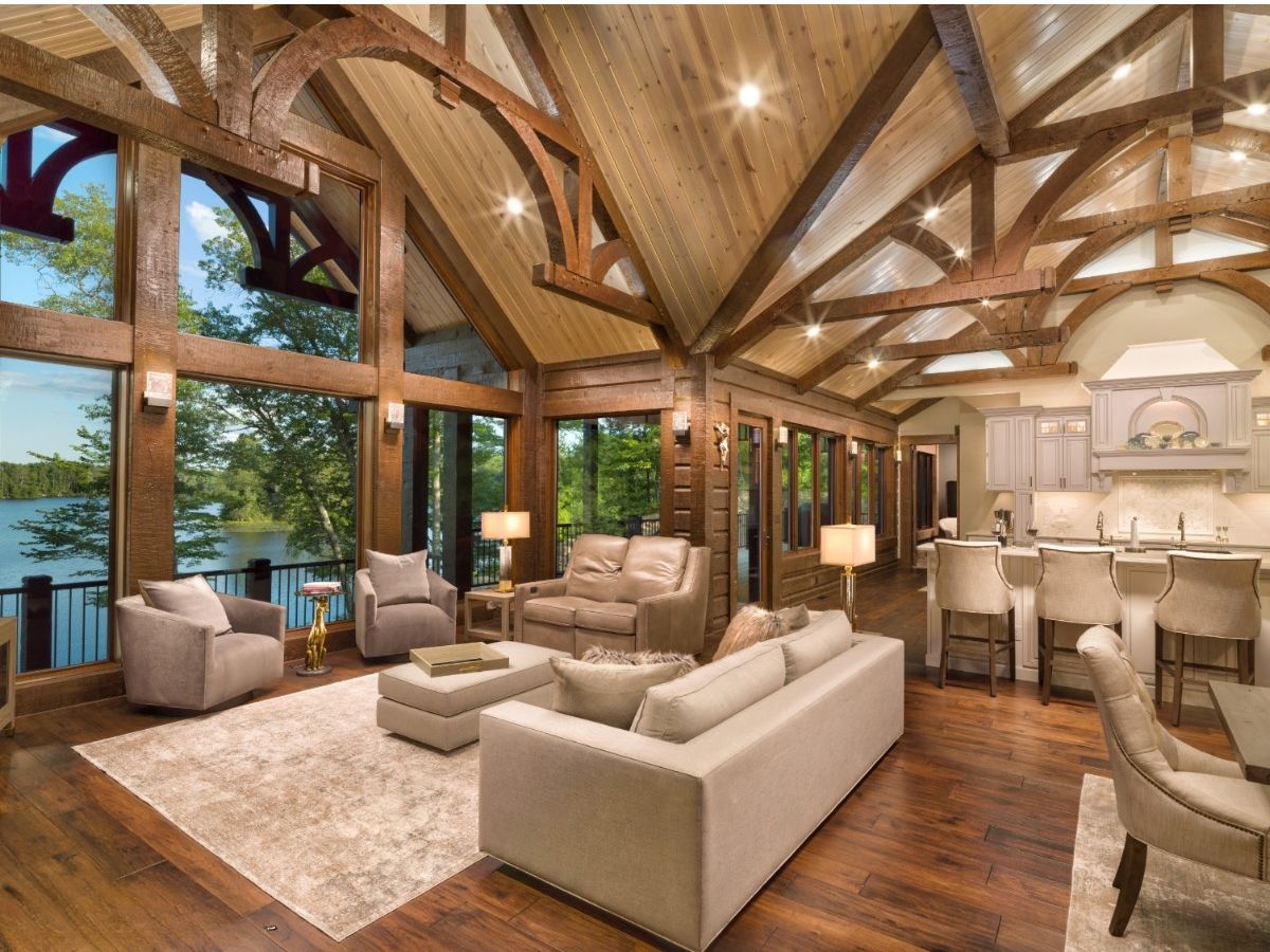 Living room with white longue area and big picture windows