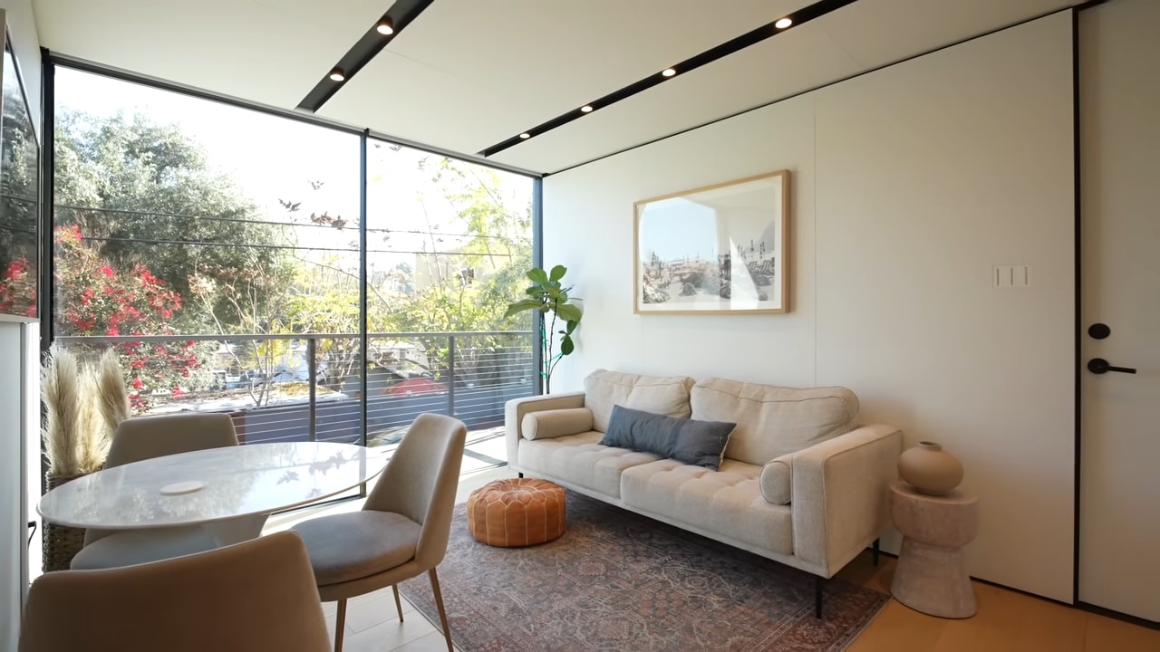 Living room with white couch and a glass sliding door