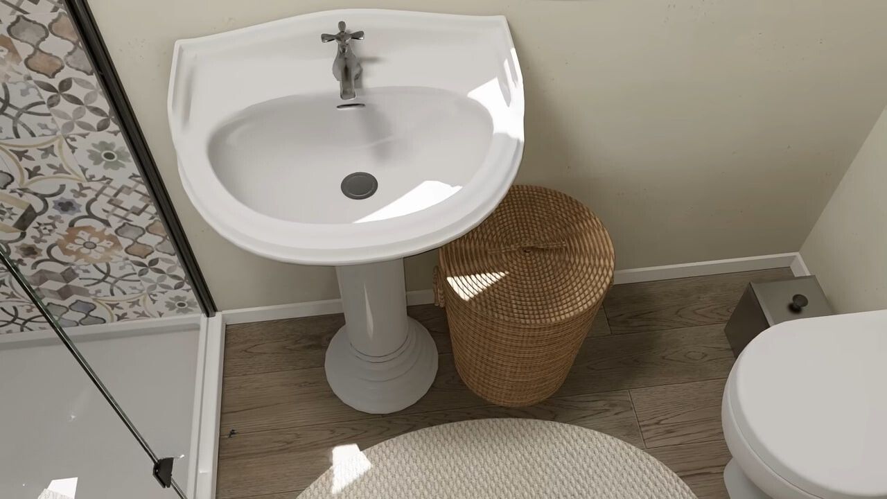 Porcelain sink and toilet with a wooden basket