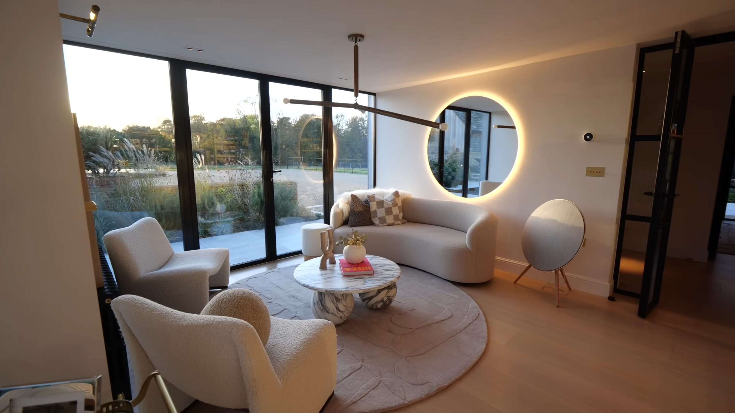 Sundown room with a comfortable lounge area and a light-up mirror