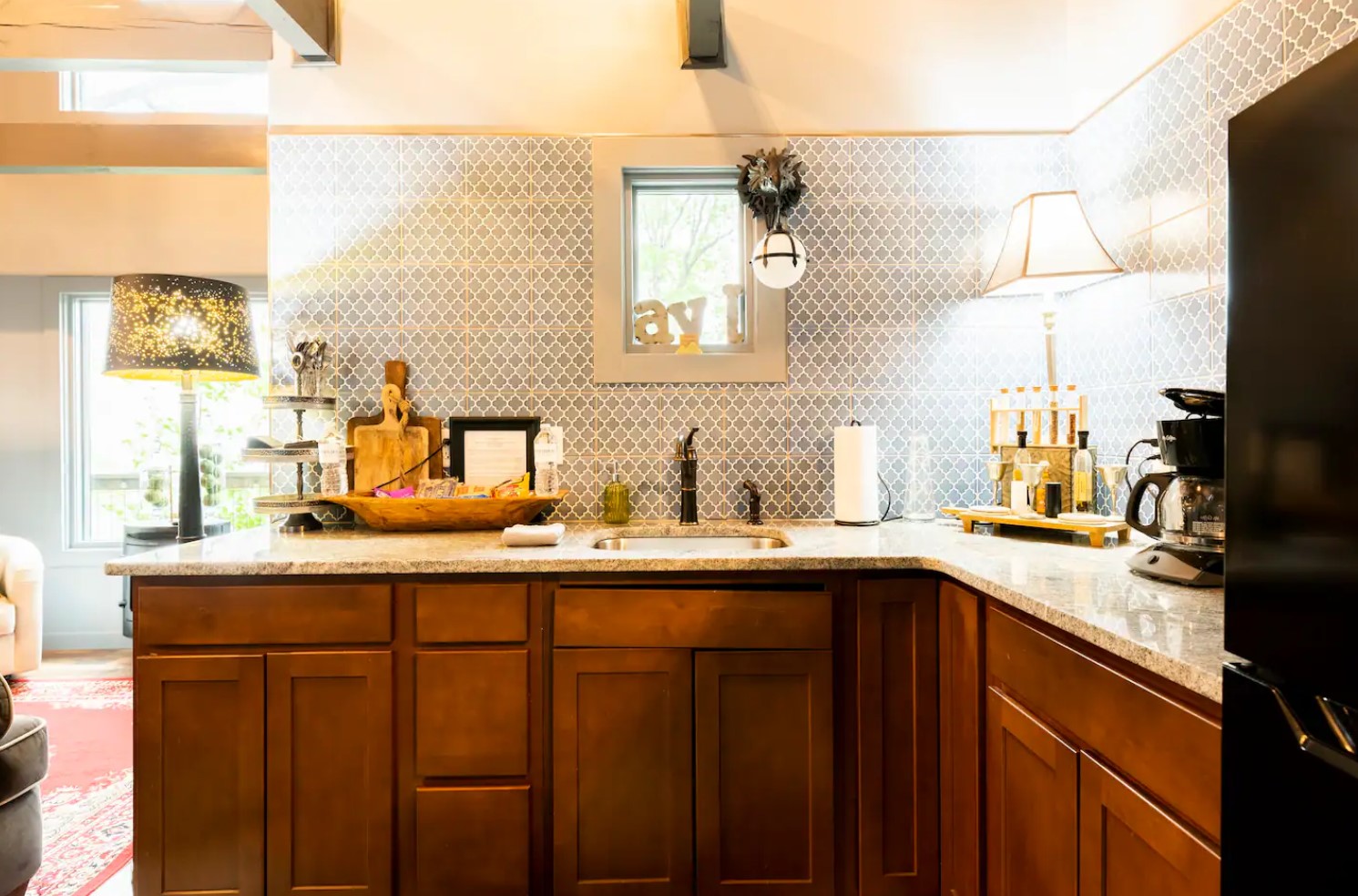 Cozy kitchen with wooden cabinets and marble countertop