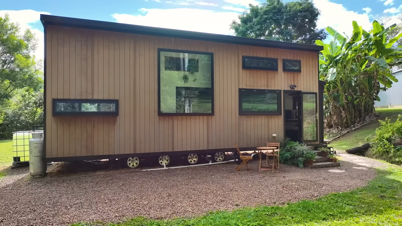 Tiny trailer home with wooden walls