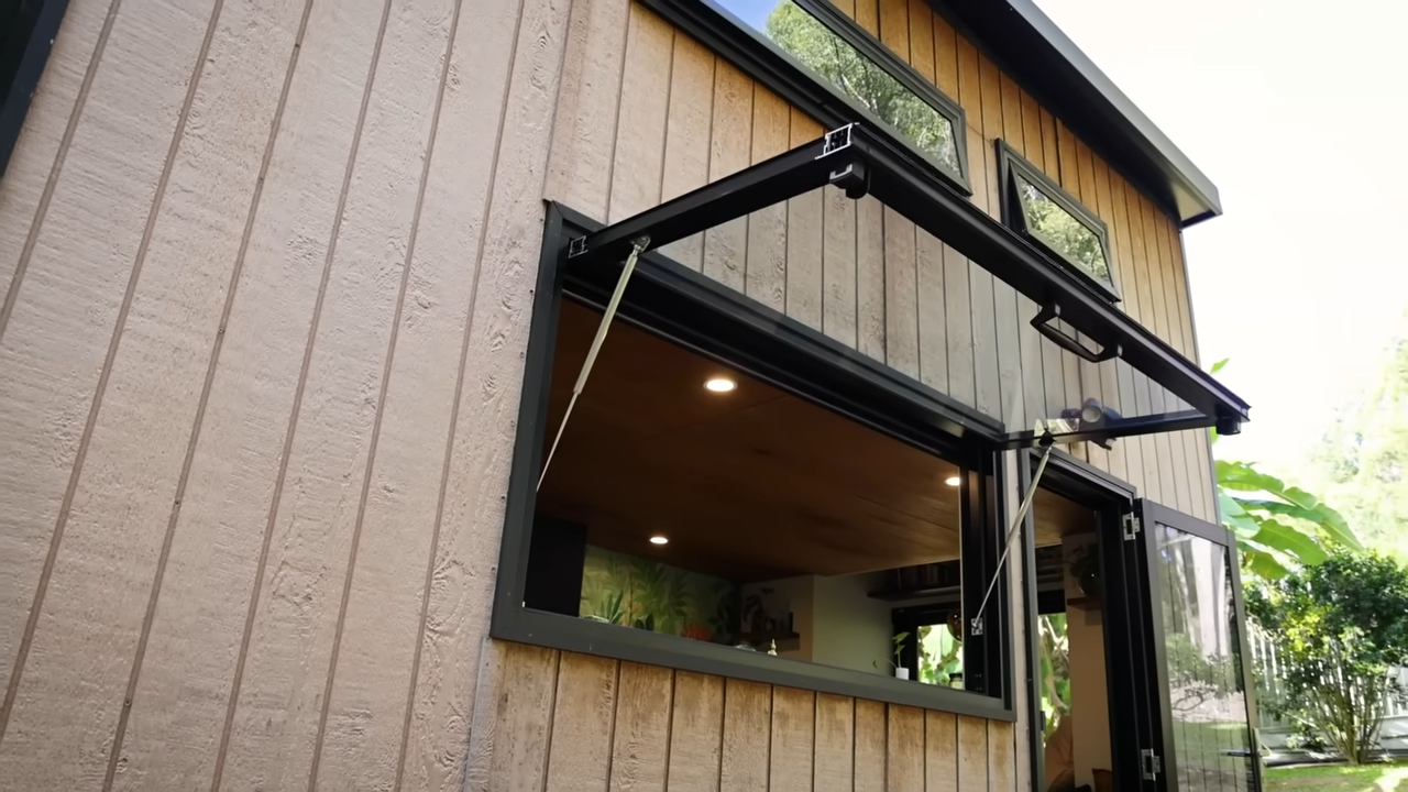 Unique windows on a tiny home that open up entirely