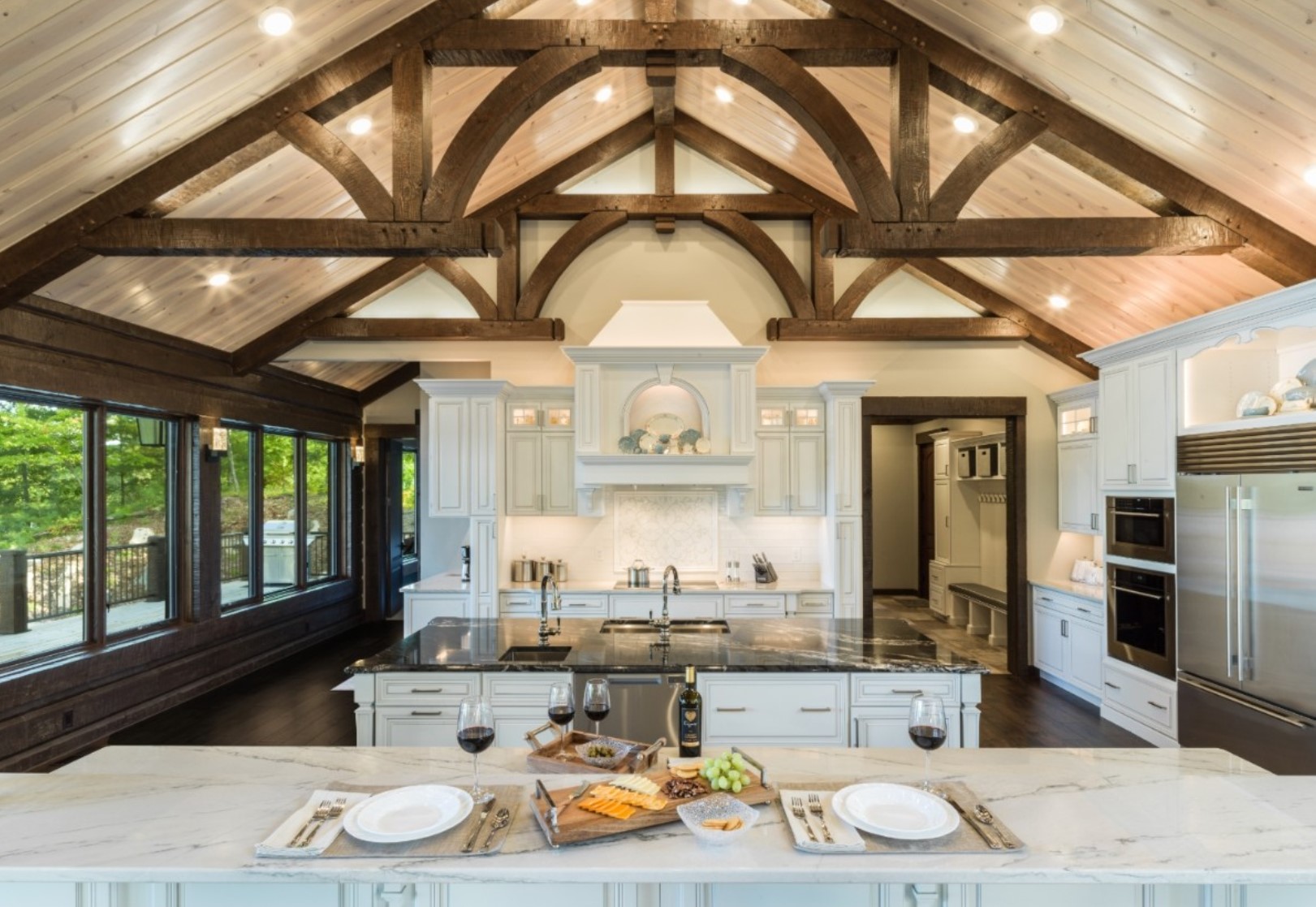 White kitchen with huge island and tons of cabinets